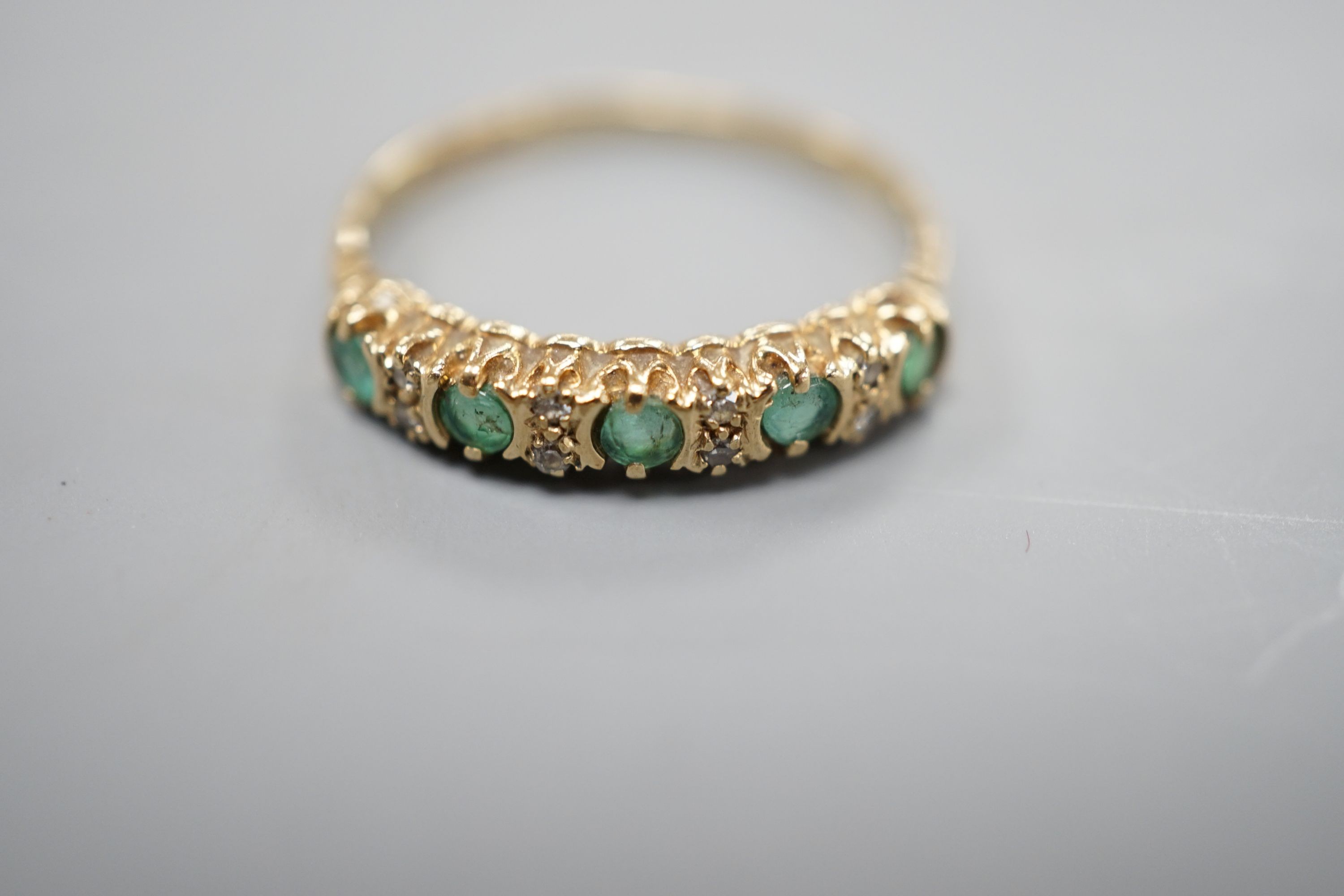 A 1962 gold sovereign, on 9ct bracelet with a 9ct gold gem set ring, gross weight 17.7 grams.